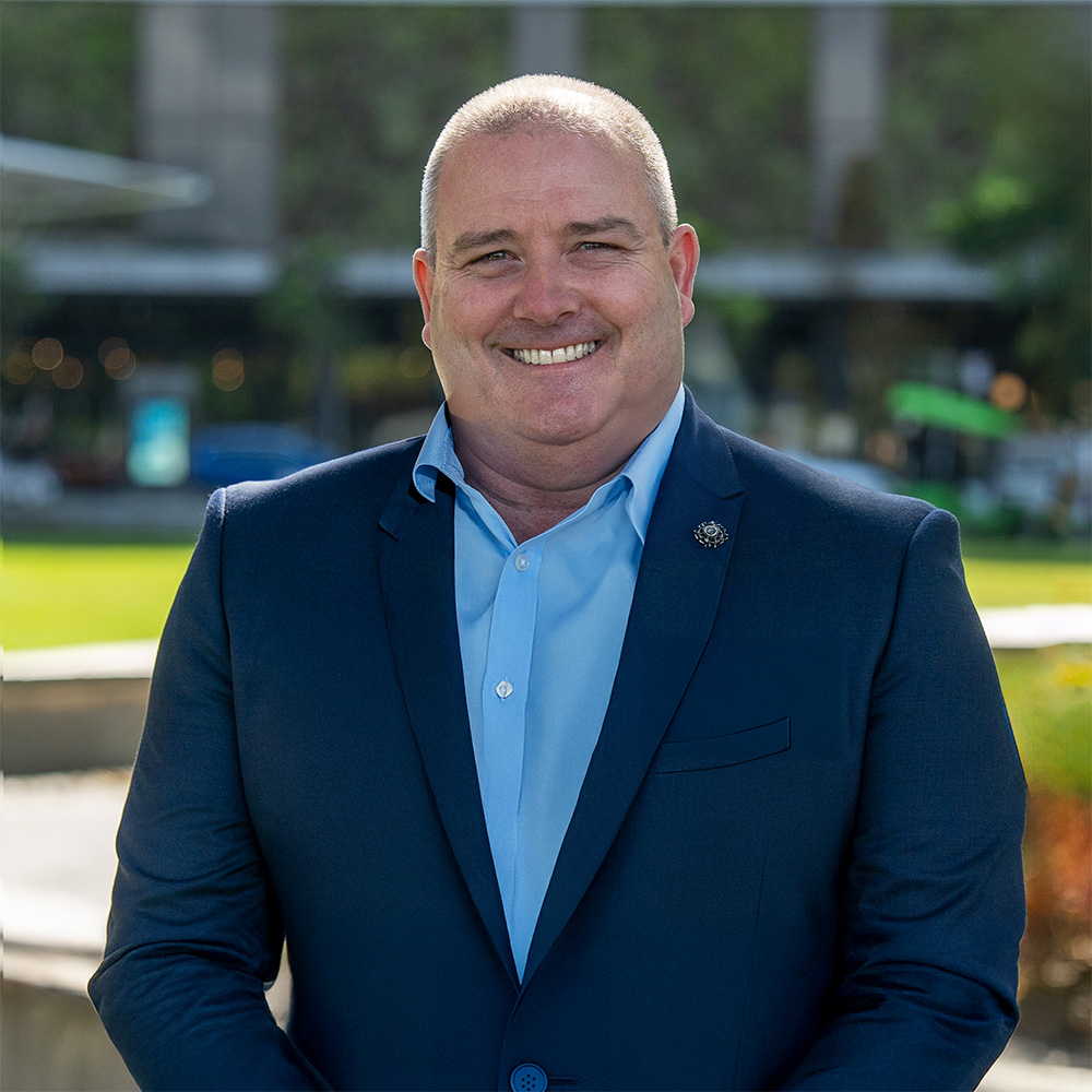 Senior Lawyer Jed McNamara in the gardens on the Sunshine Coast CBD outside of AX Compensation Lawyers office.
